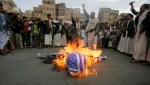 Protesters loyal to the Shi’ite al-Houthi rebel group burn an effigy of a U.S. aircraft during a demonstration in&nbsp;Yemen