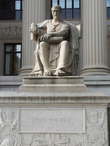 "Study the past" Or " Study the unclassified past"?  Statue on North West of the National Archives.