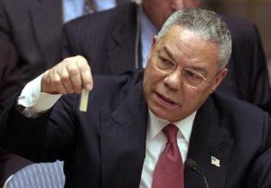 U.S. Secretary of State Colin Powell holds up a model vial of anthrax during his historic presentation before the United Nations Security Council, February 5, 2003. (Image extracted from a video available from the White House Web site.)