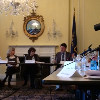 Nate Jones (R) speaking at the most recent FOIA Advisory Committee meeting. OGIS's Nikki Gramian is center, and OIP's Melanie Pustay is on the left. 